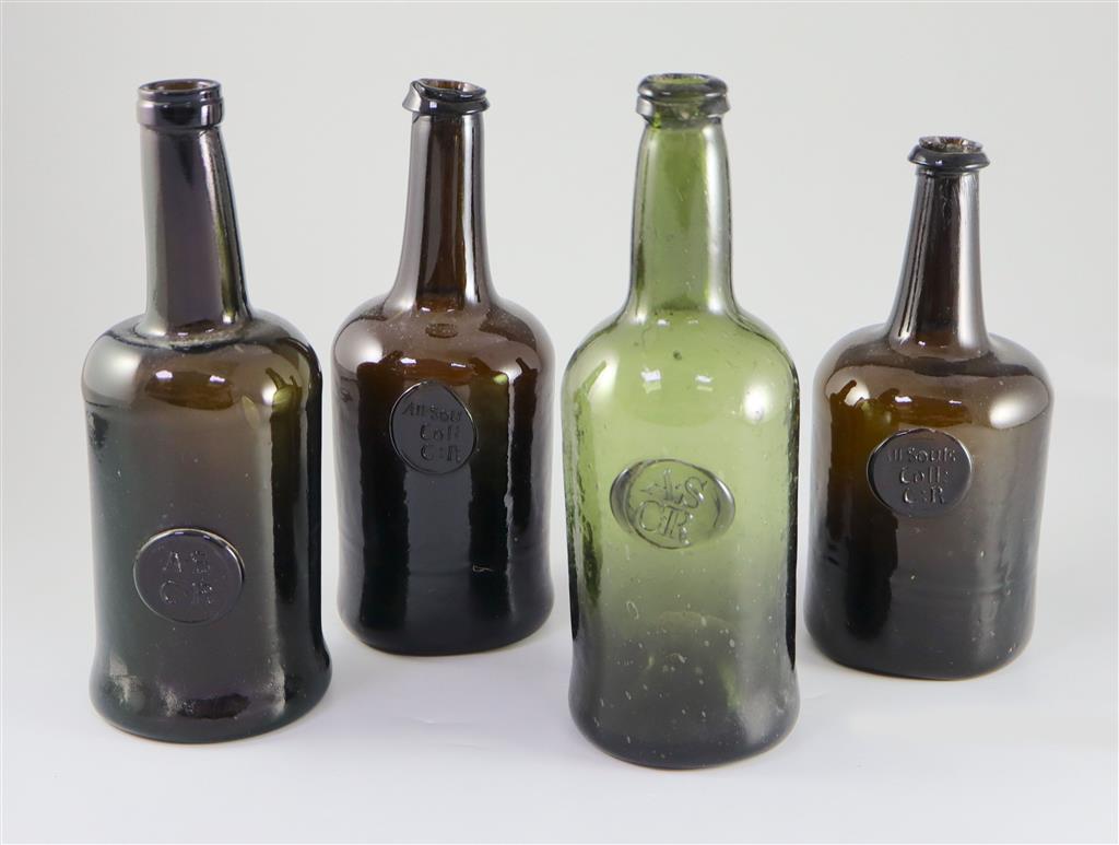 Four All Souls Common Room green glass sealed wine bottles, second half 18th century, 23 - 27cm